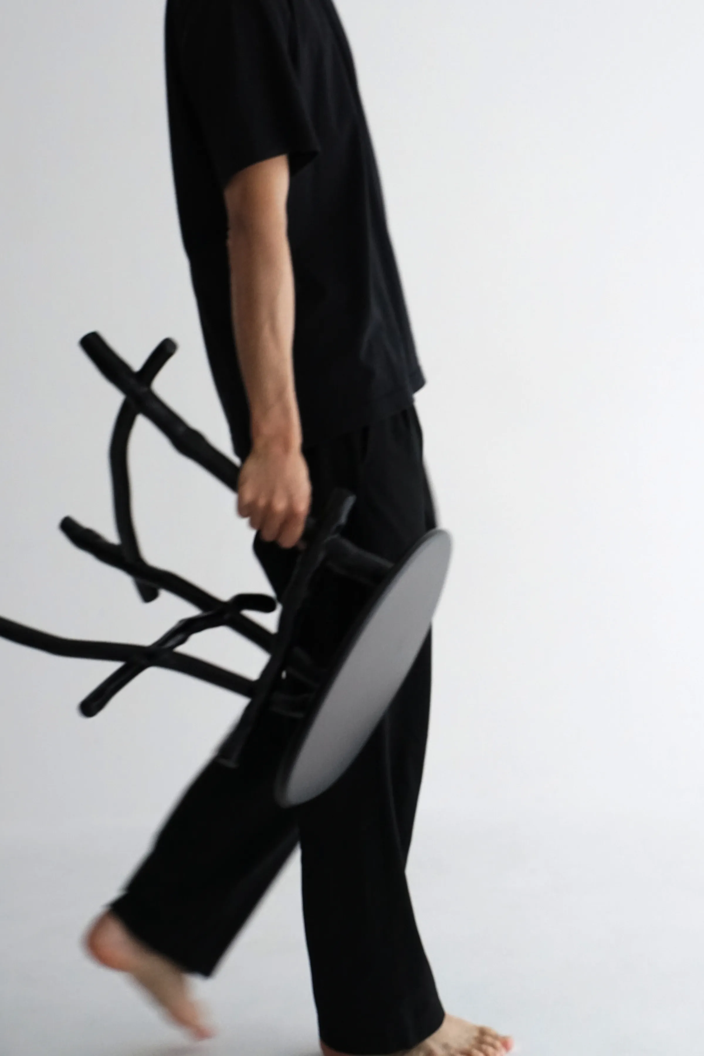 Uneri close-up detail of organic undulations of tree branches in linden plywood seat